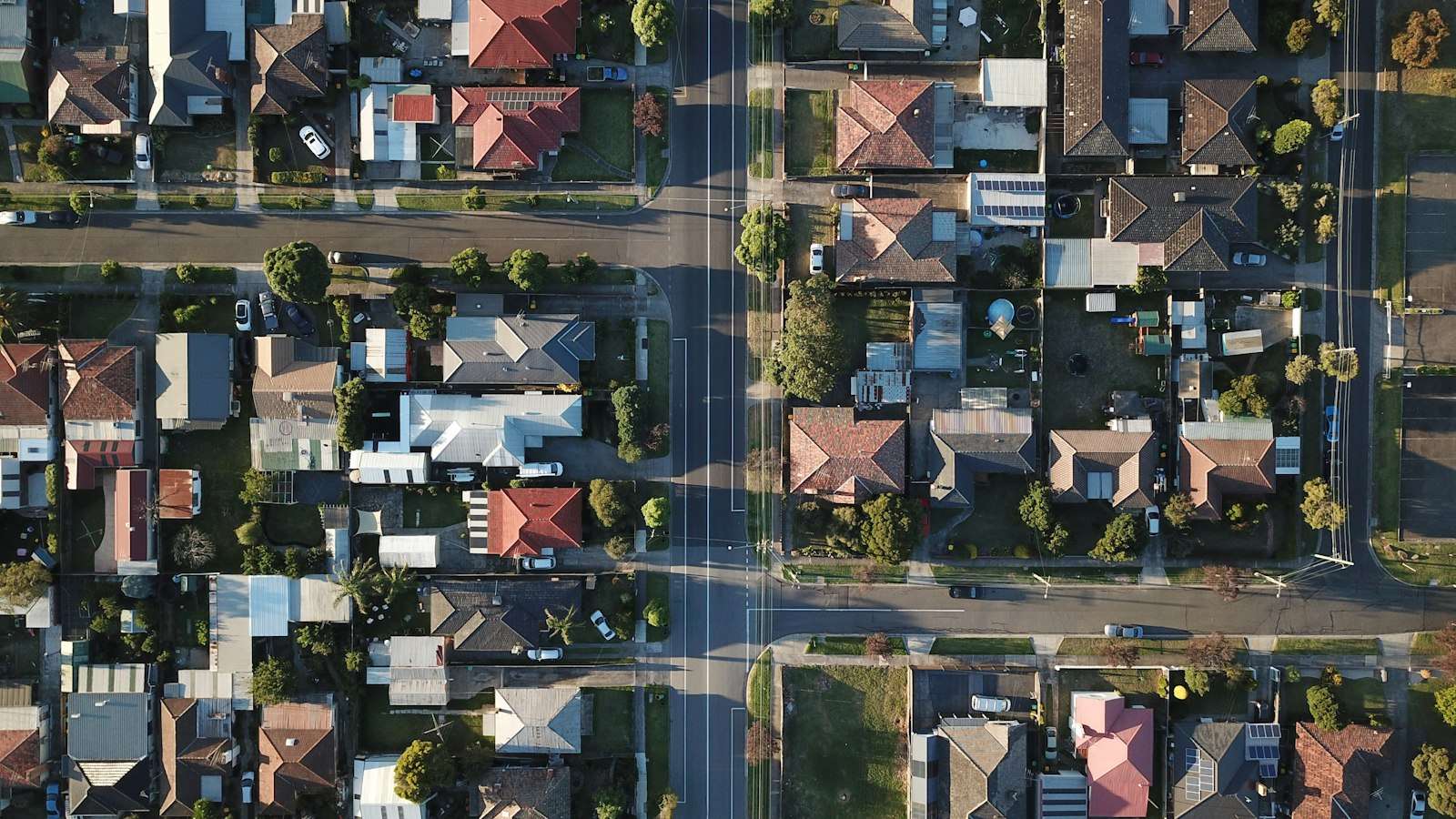 Aerial view of Australian suburban houses with red-tiled roofs