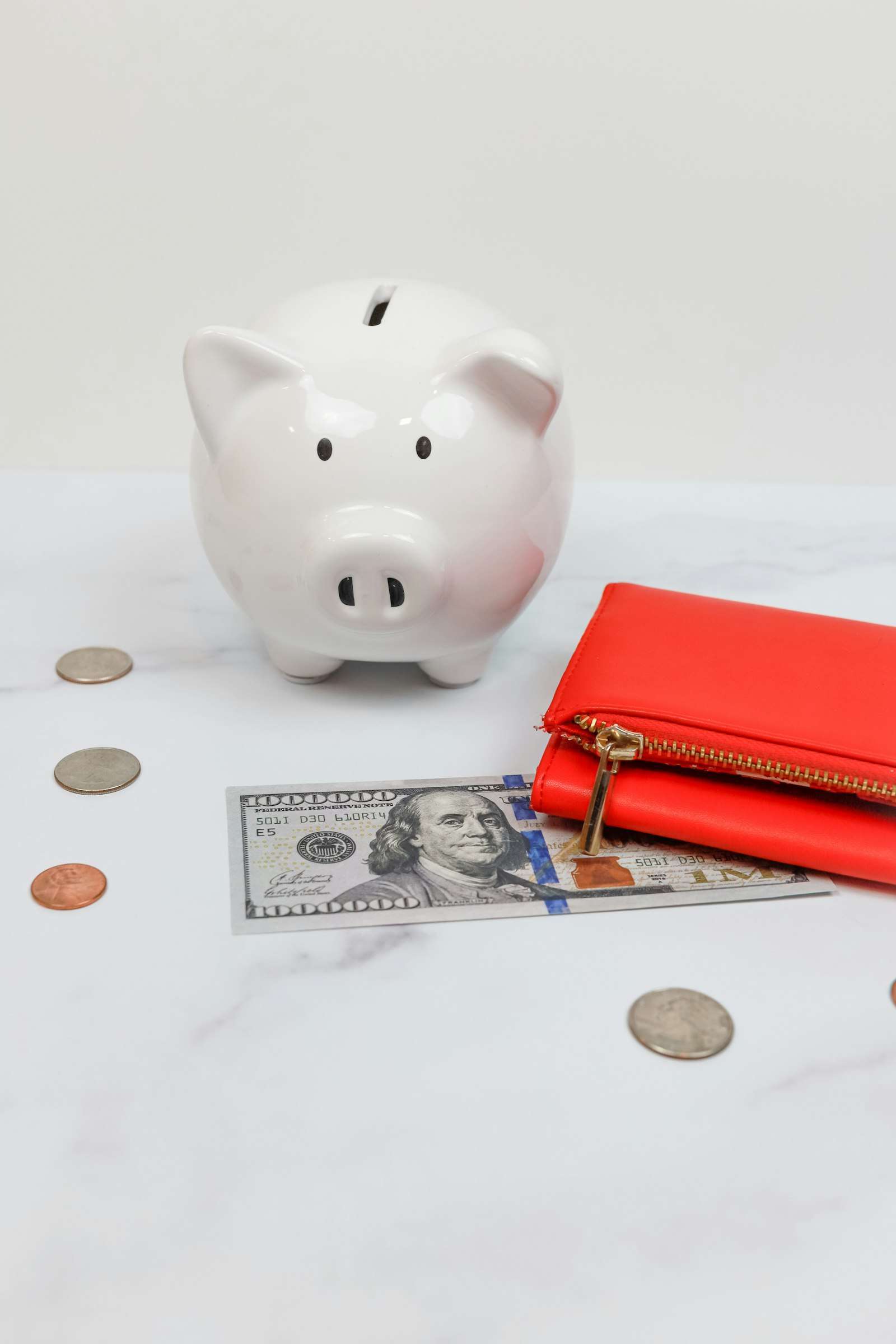 A piggy bank and coins, representing savings held in an offset account