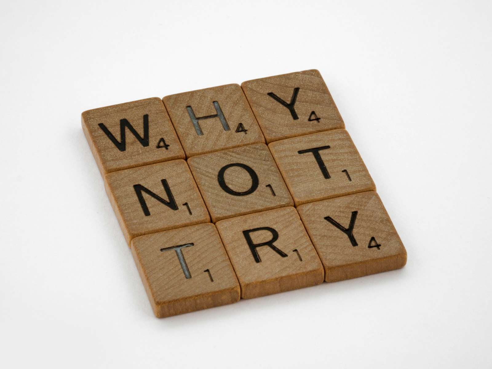 Brown wooden blocks on a white surface, representing a career transition